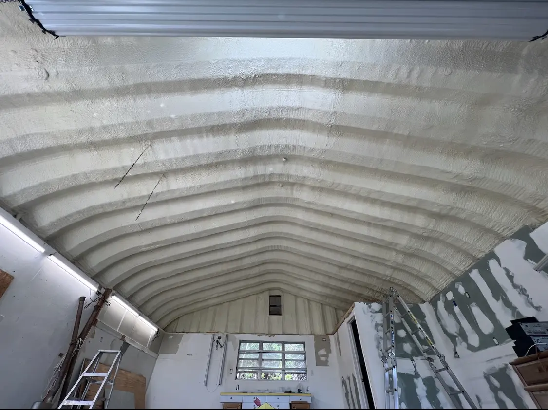 Spray polyurethane foam applied to the underside of a metal roof deck in Townsend